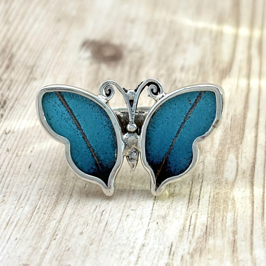Bague Azura ajustable en argent avec ailes de papillon bleues
