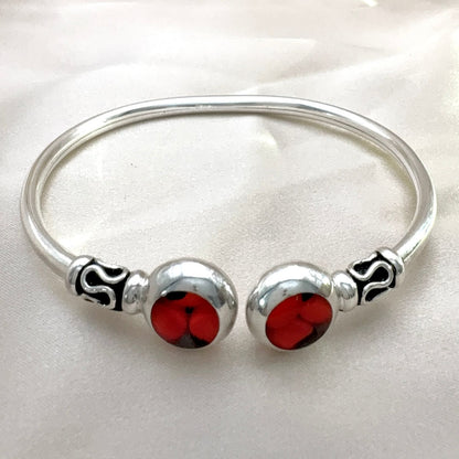 Bracelet jonc ouvert en argent avec deux motifs en huayruro