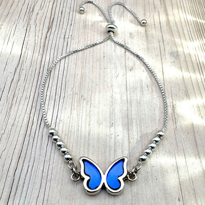 Bracelet Azuria en argent avec véritables ailes de papillon bleu profond, création artisanale de la collection Éclosion